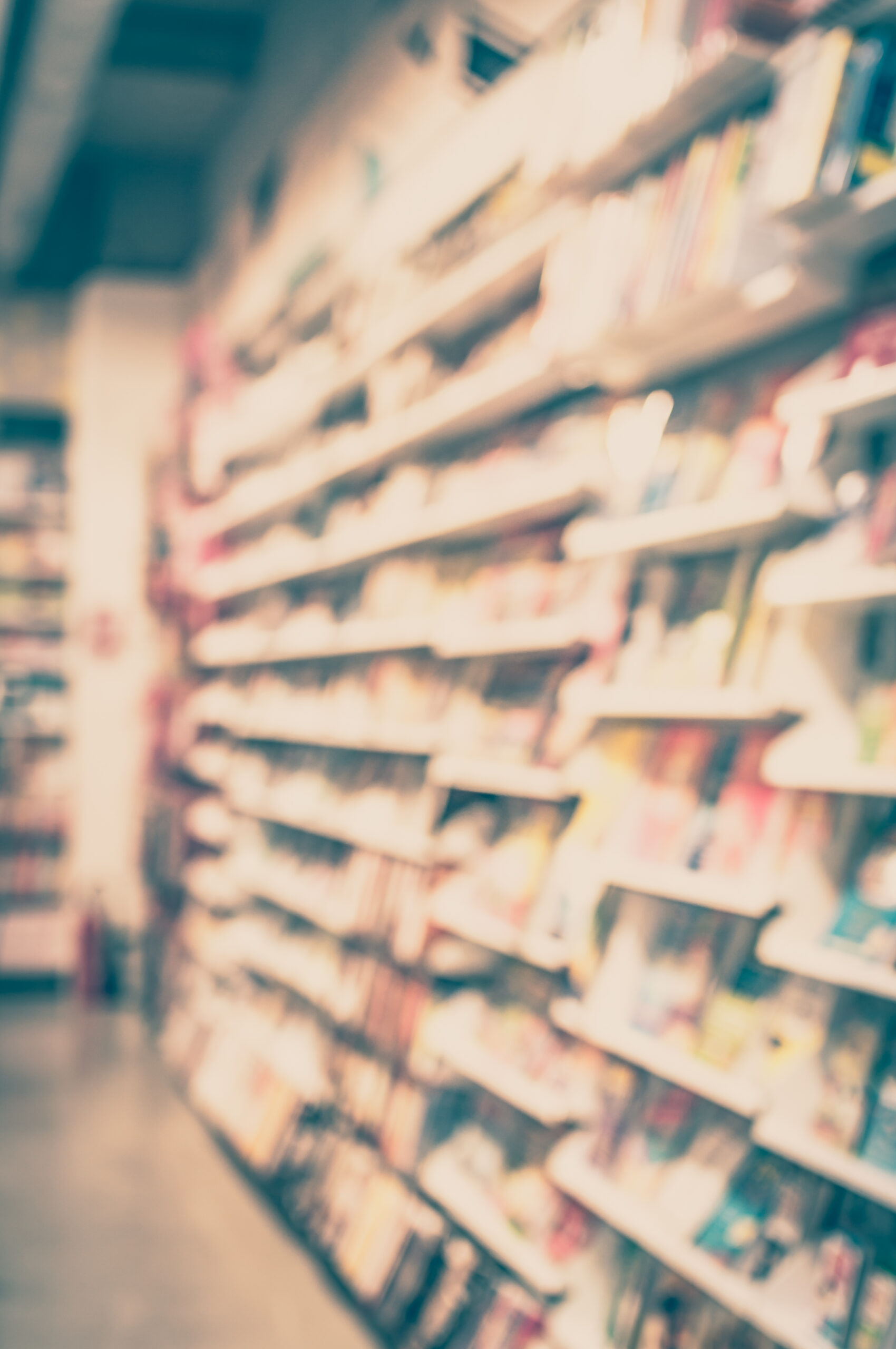 Blurred background - blurred a bookstore with bokeh. Vintage ton